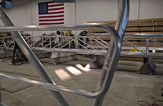 Here is an example of a custom wood and aluminum ADA handrail