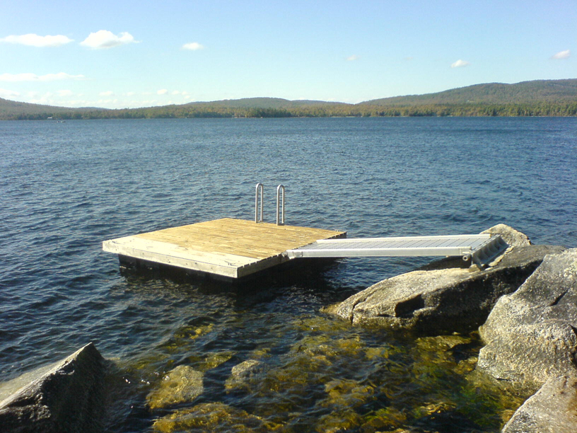 Aluminum walkway attached to a float