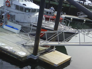 Aluminum brow at Coast Guard Station, Gloucester, MA. This brow uses i-Bar grating to allow snow and ice to fall through.