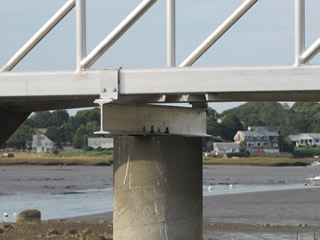 Detail feature showing attachment of pier to cement piling using our J-clamps.