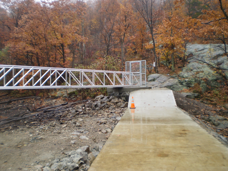 Aluminum gangway from shore to dolphin.