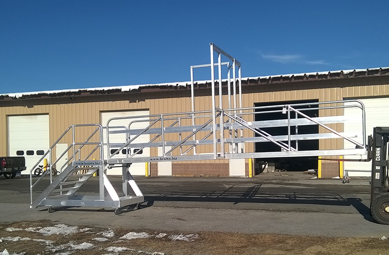 Aluminum gangway to dolphin to which barge is tied.